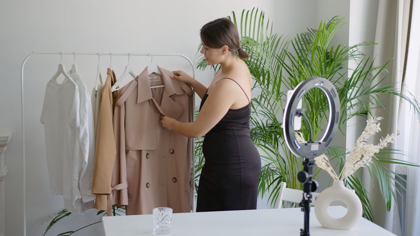 Fashion creator presenting clothes for online selling